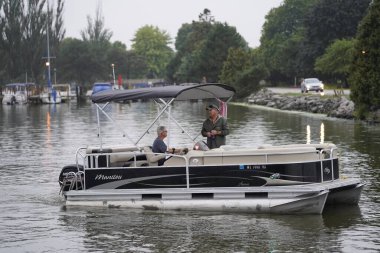 Fond du Lac, Wisconsin USA - August 26, 2019: 10th anniversary of Military Appreciation Cruise Fond du Lac Yacht Club, which  honors both active duty soldiers and military veterans by providing them some unique time on Lake Winnebago clipart