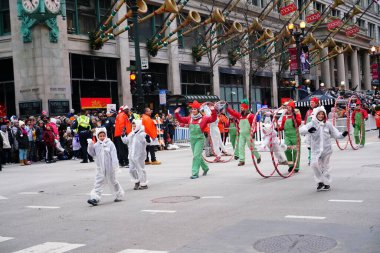Chicago, Illinois / USA - November 28th 2019: Chicago Wheel Jam by Cirques Experience specializes in Wheel Gymnastics performed in 2019 Uncle Dan's Chicago Thanksgiving Parade. clipart