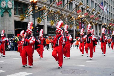 Chicago, Illinois / USA - November 28th 2019: Jonesboro, Georgia High School the Cardinals Musical Marching band marched in 2019 Uncle Dan's Chicago Thanksgiving Parade clipart