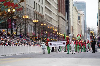 Chicago, Illinois / USA - November 28th 2019: Chicago Wheel Jam by Cirques Experience specializes in Wheel Gymnastics performed in 2019 Uncle Dan's Chicago Thanksgiving Parade. clipart