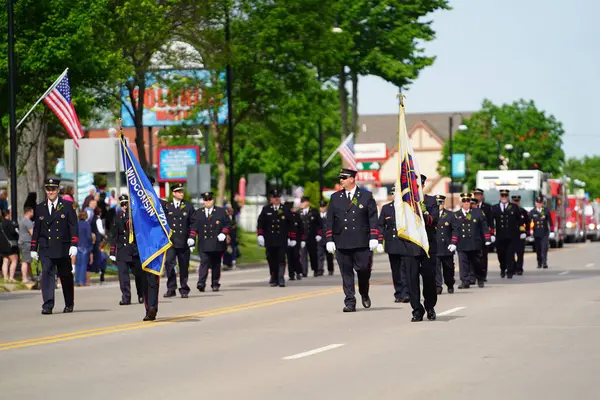 Stock image Wisconsin Dells, Wisconsin USA - May 31, 2021: Kilbourn Volunteer Fire Department rescue men walked and marched in the memorial day parade.