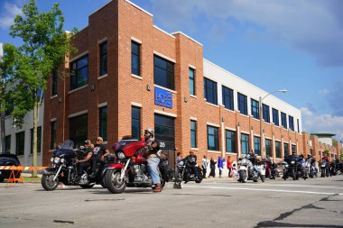 Milwaukee, Wisconsin USA - June 19th, 2021: African American motorcycle gangs participated and rode on motorcycles in Juneteenth celebration parade. clipart