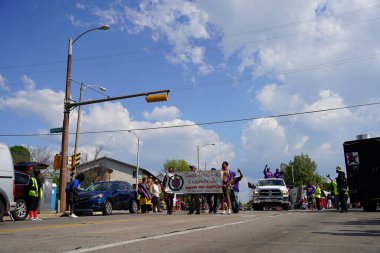 Milwaukee, Wisconsin USA - June 19th, 2021: Many local African Americans of the Milwaukee community came out to enjoy Juneteenth celebration event and parade. clipart