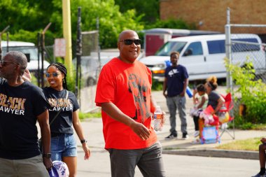 Milwaukee, Wisconsin USA - June 19th, 2021: Many local African Americans of the Milwaukee community came out to enjoy Juneteenth celebration event and parade. clipart