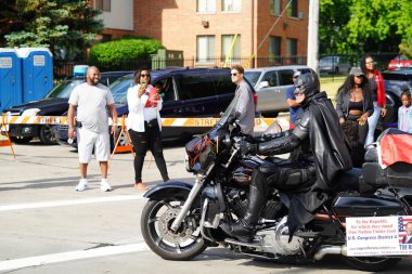 Milwaukee, Wisconsin USA - June 19th, 2021: African American motorcycle gangs participated and rode on motorcycles in Juneteenth celebration parade. clipart