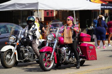Milwaukee, Wisconsin USA - June 19th, 2021: African American motorcycle gangs participated and rode on motorcycles in Juneteenth celebration parade. clipart