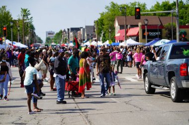 Milwaukee, Wisconsin USA - June 19th, 2021: Many local African Americans of the Milwaukee community came out to enjoy Juneteenth celebration event and parade. clipart