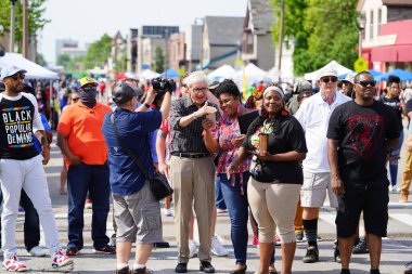 Milwaukee, Wisconsin USA - June 19th, 2021: Wisconsin Democrat governor Tony Evers attended the Juneteenth festival event and interacted with African American locals. clipart