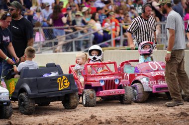 Pickett, Wisconsin / USA - September 18th, 2020: Power wheels with kids driven in hollywood motorsports entertainment annual paws for the cause demolition derb clipart