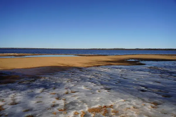 Water ponds developed on the beach during low water tide season.