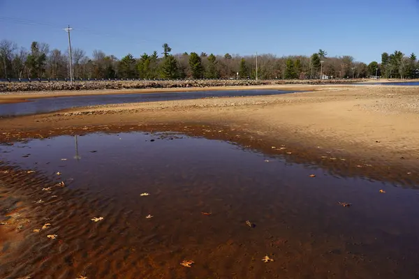Water ponds developed on the beach during low water tide season.