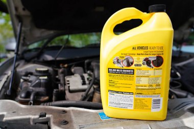 Fond du Lac, Wisconsin USA - May 19th, 2021: Back side of 1 gallon of ready to use Prestone antifreeze and coolant for all vehicles. clipart