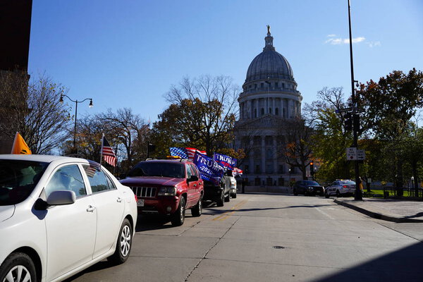 Madison, Wisconsin / USA - November 1st, 2020: President donald trump and blue lives matter supporters rallied and stormed in madison at the capitol building grounds in a convoy of vehicles.