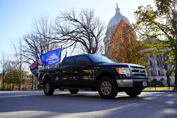 Madison, Wisconsin / USA - November 1st, 2020: President donald trump and blue lives matter supporters rallied and stormed in madison at the capitol building grounds in a convoy of vehicles.