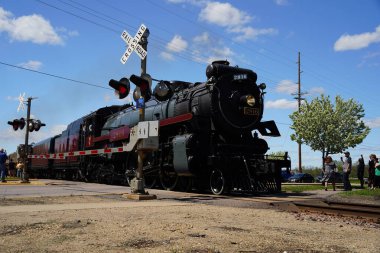 Tomah, Wisconsin USA - May 5th, 2024: Canadian Pacific 2816 Empress locomotive steam train engine traveled through Wisconsin during the Final Spike event. clipart