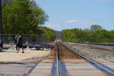 Tomah, Wisconsin USA - May 5th, 2024: People waited at an Amtrak train depot to take their ride.