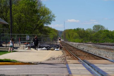 Tomah, Wisconsin USA - May 5th, 2024: People waited at an Amtrak train depot to take their ride.
