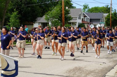 Appleton, Wisconsin USA - June 8th, 2024: High school marching band marched through the Flag Day Parade. clipart