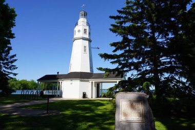 Neenah Kimberly Point Lighthouse sits on Winnebago Lake in Wisconsin. clipart