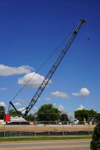 stock image Ripon, Wisconsin USA - May 12th, 2024: Link-Belt 298 Series 2 construction crane used by C.D. Smith construction at a construction site.