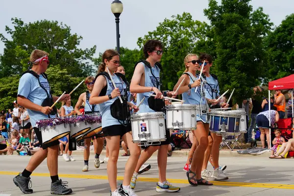 stock image Sheboygan, Wisconsin USA - July 4th, 2024: High school male and female drumline group participated in the Freedom Fest parade.