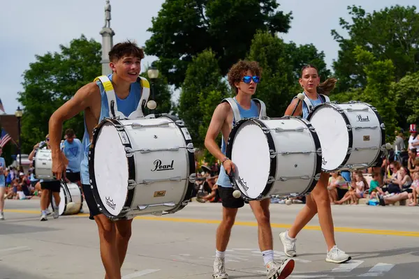 stock image Sheboygan, Wisconsin USA - July 4th, 2024: High school male and female drumline group participated in the Freedom Fest parade.