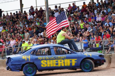 Fond du Lac, Wisconsin USA - July 21st, 2024: Hollywood Motorsports Entertainment held their annual paws for the cause demolition derby car wrecking at Fond du Lac county fair. clipart