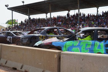 Fond du Lac, Wisconsin USA - July 21st, 2024: Hollywood Motorsports Entertainment held their annual paws for the cause demolition derby car wrecking at Fond du Lac county fair. clipart