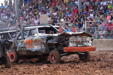 Fond du Lac, Wisconsin USA - July 21st, 2024: Hollywood Motorsports Entertainment held their annual paws for the cause demolition derby car wrecking at Fond du Lac county fair. clipart