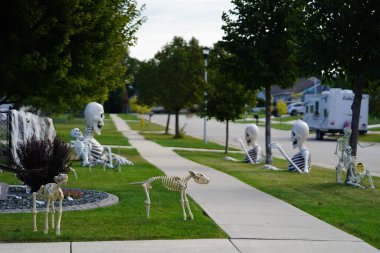 Fond du Lac, Wisconsin USA - October 4th, 2024: Homeowners of the community dressed up their house and yard with scary Halloween decorations for 2024. clipart