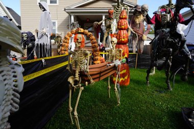 Fond du Lac, Wisconsin USA - October 4th, 2024: Homeowners of the community dressed up their house and yard with scary Halloween decorations for 2024. clipart