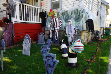 Fond du Lac, Wisconsin USA - October 4th, 2024: Homeowners of the community dressed up their house and yard with scary Halloween decorations for 2024. clipart