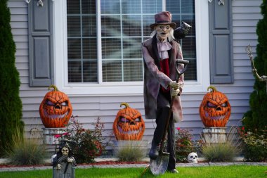 Fond du Lac, Wisconsin USA - October 4th, 2024: Homeowners of the community dressed up their house and yard with scary Halloween decorations for 2024. clipart