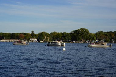 Green Lake, Wisconsin USA - September 28th, 2024: Waterfront harbor and marina on a lake. clipart