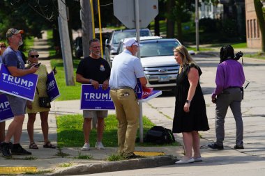 Milwaukee, Wisconsin USA - August 16th, 2024: Pro President Trump and Pro VP J.D. Vance supporters rallied outside the Milwaukee Police Association during J.D. Vance's political campaign stop. clipart