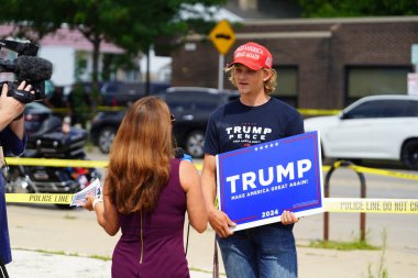 Milwaukee, Wisconsin USA - August 16th, 2024: Pro President Trump and Pro VP J.D. Vance supporters rallied outside the Milwaukee Police Association during J.D. Vance's political campaign stop. clipart