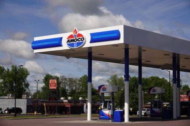 Mauston, Wisconsin USA - May 23rd, 2025: Amoco fuel station sign on a fuel station building advertising to the community.