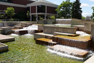 Man made Plaza waterfall fountain in the center of downtown.