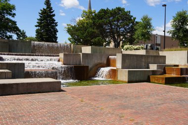 Man made Plaza waterfall fountain in the center of downtown.