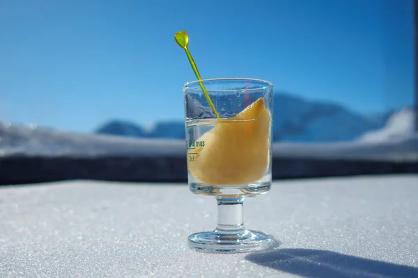 One Shot Glass Filled Schnapps Piece Pear Stands Snow Front Fotos de stock libres de derechos