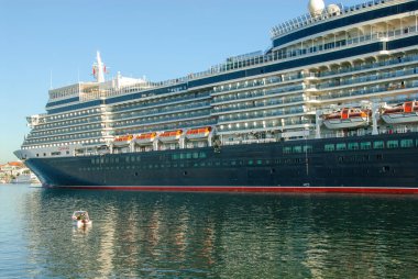 the luxury cruise ship Queen Elisabeth enters the port of Luebeck-Travemuende