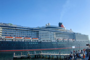 the luxury cruise ship Queen Elisabeth enters the port of Luebeck-Travemuende