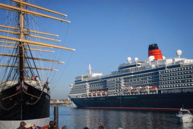 the luxury cruise ship Queen Elisabeth enters the port of Luebeck-Travemuende