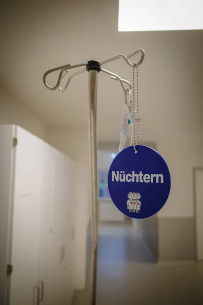 The German word nuechtern (sober) is written on a sign on a hospital bed