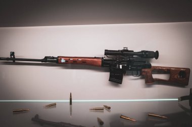 An old Dragunov sniper rifle hangs on the wall clipart