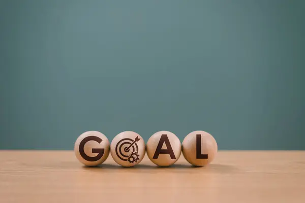Goal setting planning focus for future. Goal aim target concept. Hand push target board on wooden cube block icon for creative set up business success objective. Achievement winner business project