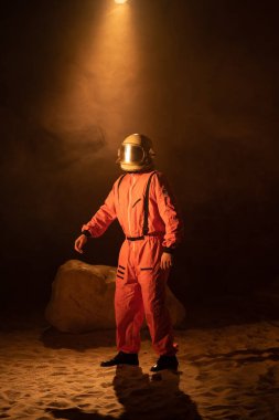 Space man walks on the red planet Mars. space mission. Astronaut travel in space.