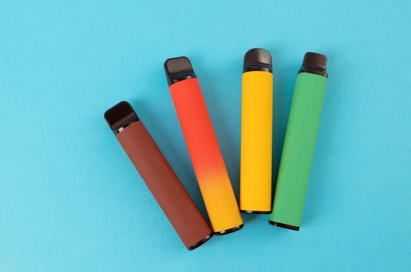Set Colorful Disposable Electronic Cigarettes Blue Background Concept Modern Smoking — ストック写真