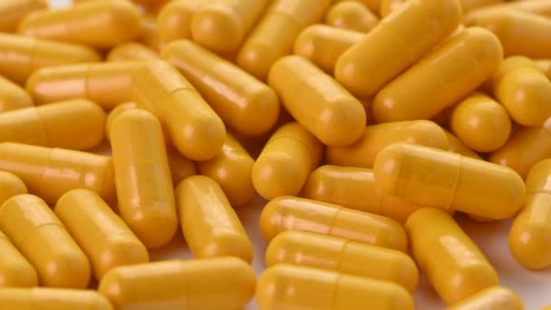 Yellow Pills Capsules Isolated White Background Close High Quality Footage — Stock Video