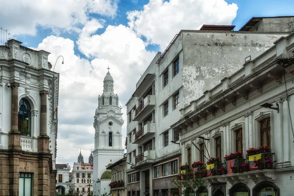 Traditional colonial style architecture and Old steeple from Quito's cathedral in the downtown area. Quito, Ecuador, South America
